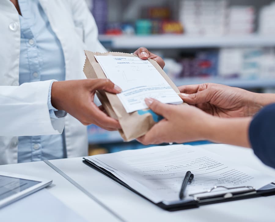A customer picks up their prescription